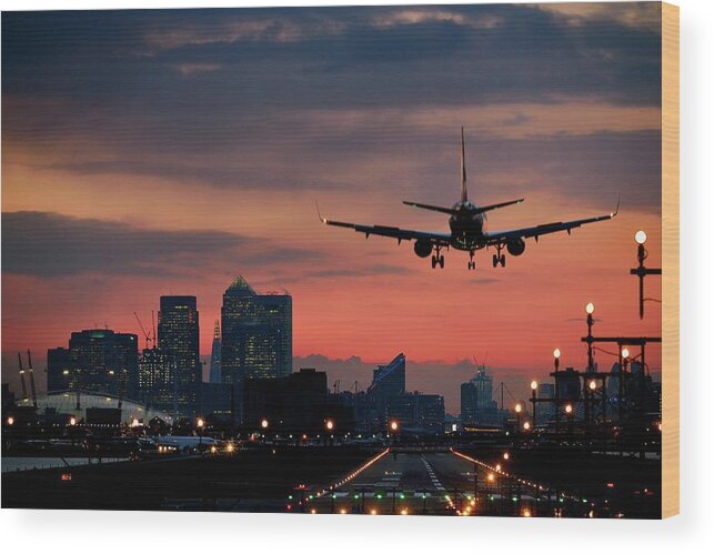 Mid-air Wood Print featuring the photograph Landing Airplane At Dusk by Vladimir Zakharov