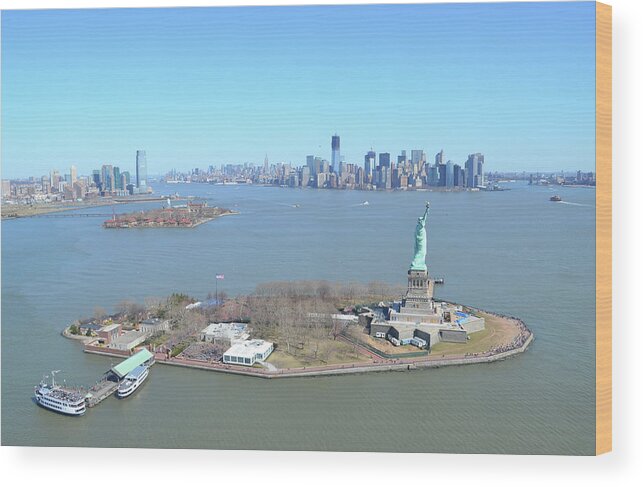 Ferry Wood Print featuring the photograph Liberty And Ellis Island With Manhattan by Mrtom-uk