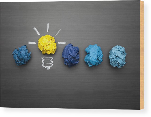 Motivation Wood Print featuring the photograph Light bulb crumpled paper on blackboard - Idea Concept Background by ThomasVogel
