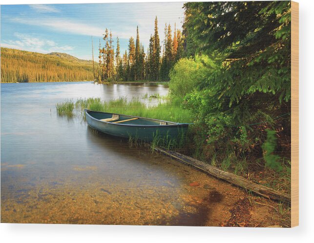 Tranquility Wood Print featuring the photograph Lone Canoe On Shores Of Upper Payette by Anna Gorin