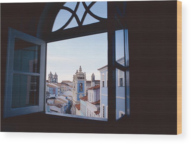 Shutter Wood Print featuring the photograph Looking Out The Windows Of A Dark Room To See Buildings And The Blue Sky With White Clouds by Rubberball/Heinz Hubler