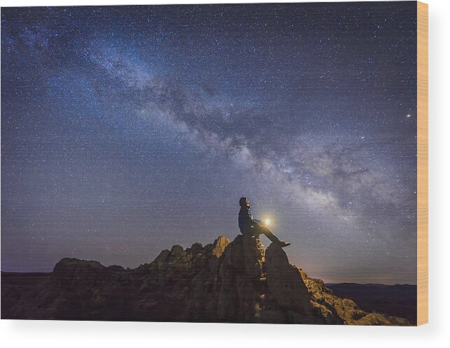 Astrophysics Wood Print featuring the photograph Man sitting under The Milky Way Galaxy by Bjdlzx