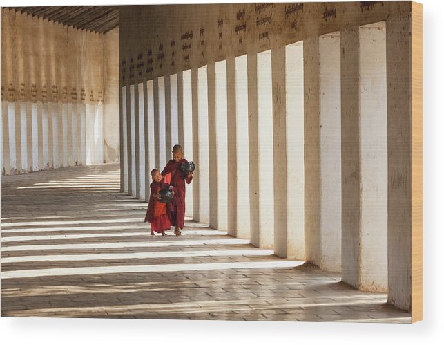 Asian And Indian Ethnicities Wood Print featuring the photograph Monks In Walkway To Shwezigon Pagoda by Peter Adams