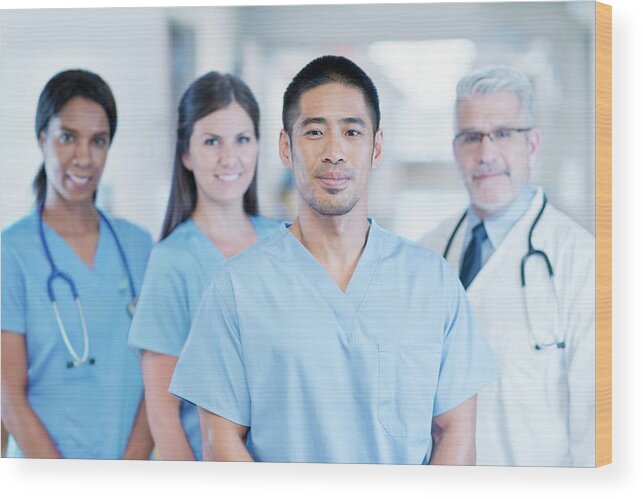 30-34 Years Wood Print featuring the photograph Multiracial Medical Team by Science Photo Library