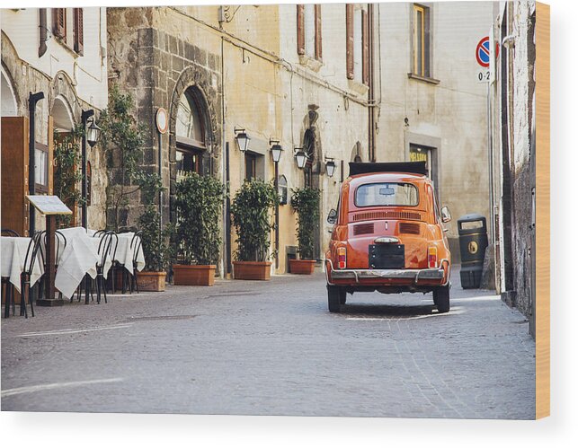 Simple Living Wood Print featuring the photograph Old red vintage car on the narrow street in Italy by Alexander Spatari
