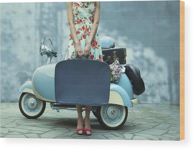 Asian And Indian Ethnicities Wood Print featuring the photograph Pacific Islander woman holding suitcase near vintage scooter by Colin Anderson Productions pty ltd