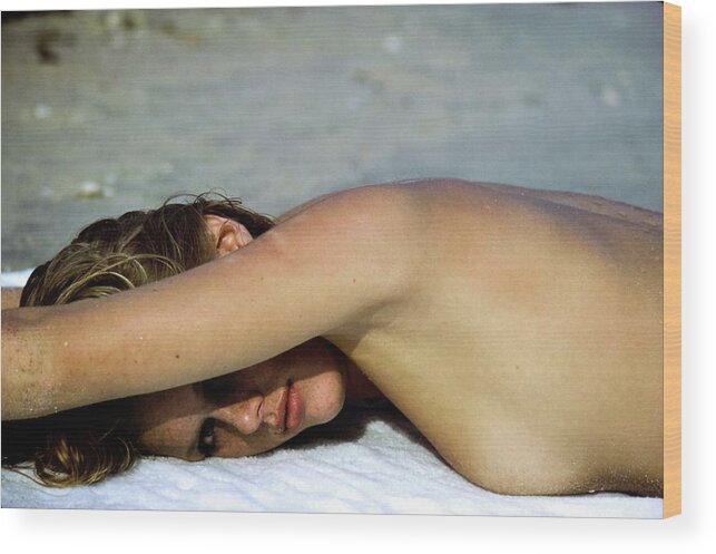 #condenastvoguephotograph Wood Print featuring the photograph Patti Hansen Topless On A Beach by Arthur Elgort
