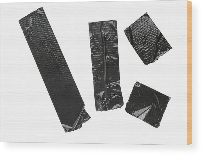 White Background Wood Print featuring the photograph Pieces Of Black Duct Tape Isolated On White by Difydave