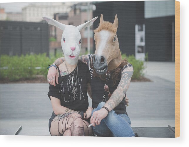 Horse Wood Print featuring the photograph Portrait of punk hippy couple wearing rabbit and horse costume masks by Eugenio Marongiu