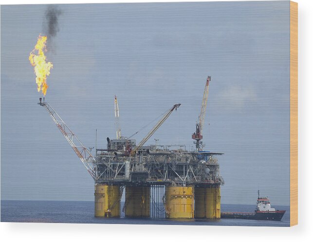 Oil Rig Wood Print featuring the photograph Production platform with flare by Bradford Martin