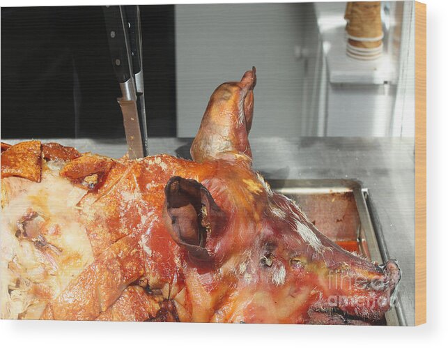 Knives Wood Print featuring the photograph Roasted whole pork by Patricia Hofmeester