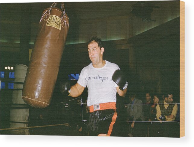 Marvin Newman Wood Print featuring the photograph Rocky Marciano Working Heavy Bag by Retro Images Archive