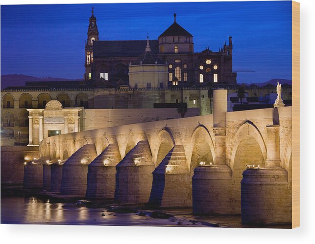 Cordoba Wood Print featuring the photograph Roman Bridge and Mezquita in Cordoba at Dawn by Artur Bogacki