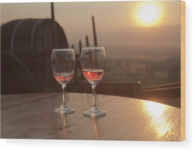Afterglow Wood Print featuring the photograph Romantic sunset with a glass of wine by Maria Heyens