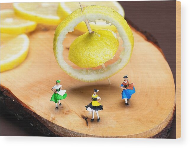 Dancer Wood Print featuring the photograph Rotating dancers and lemon gyroscope food physics by Paul Ge