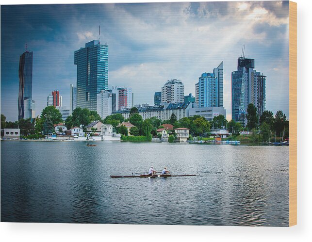 Skyline Wood Print featuring the photograph Rowing Boat And The Skyline Of Vienna by Andreas Berthold