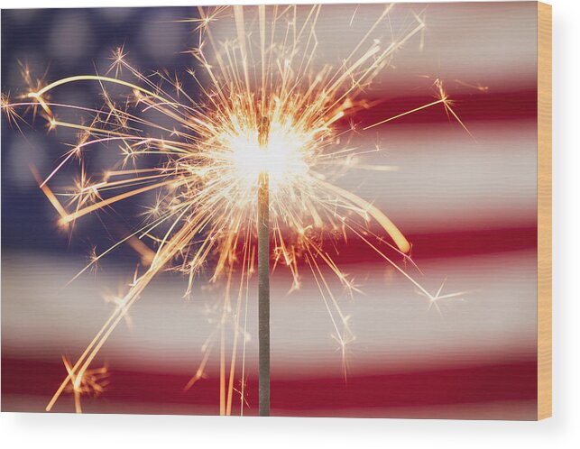 Celebration Wood Print featuring the photograph Sparkler and American flag by Tetra Images