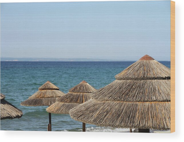 Straw Hat Wood Print featuring the photograph Straw Parasols by Suzyco