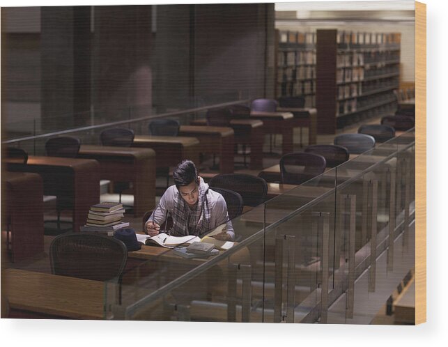 Young Men Wood Print featuring the photograph Student working in library at night by Sam Edwards