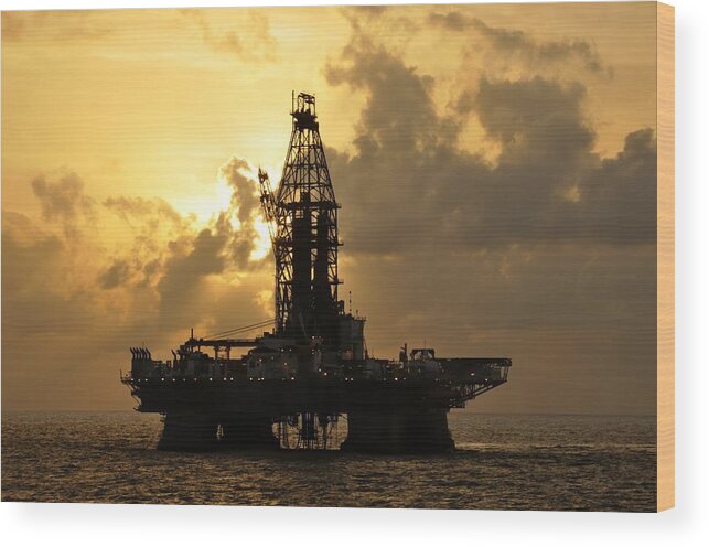 Deepwater Horizon Wood Print featuring the photograph Sun behind oil rig with clouds by Bradford Martin