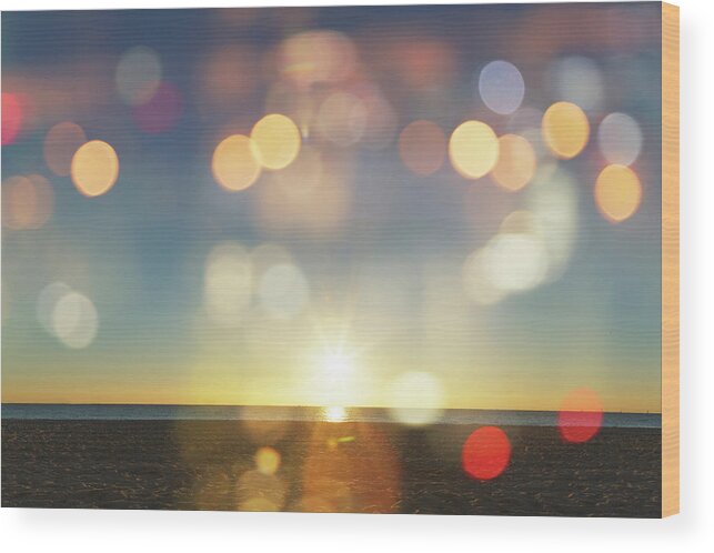 Scenics Wood Print featuring the photograph Sunrise With Lens Flares Over A Beach by Buena Vista Images