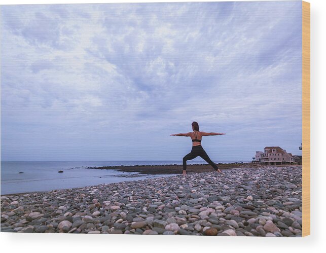 Horizon Over Water Wood Print featuring the photograph Warrior 2 Yoga Pose At Sunset On Beach by Lucie Wicker