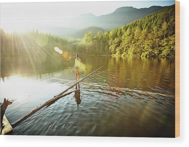 Pets Wood Print featuring the photograph Woman Walking On Log In Alpine Lake by Thomas Barwick