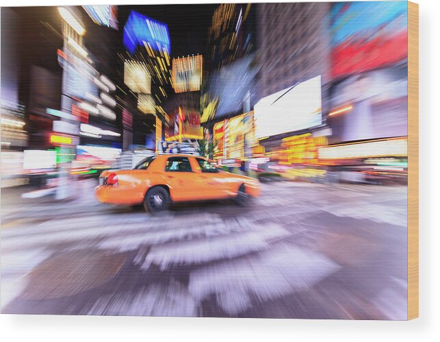 Blurred Motion Wood Print featuring the photograph Yellow Taxi Cab In Times Square, New by Fred Froese