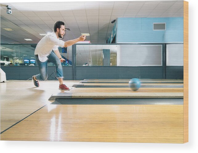 Young Men Wood Print featuring the photograph Young Man Bowling by RoBeDeRo