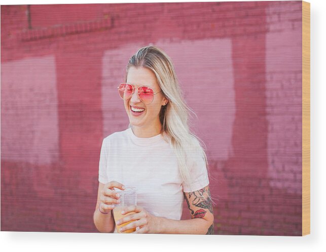 Youth Culture Wood Print featuring the photograph Young woman drinking juice by Stephen Zeigler