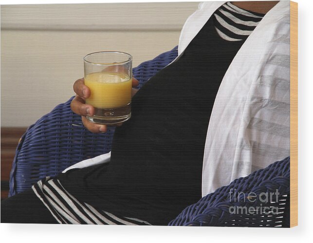 9 Months Wood Print featuring the photograph Pregnant Woman Drinking Orange Juice #2 by Photo Researchers