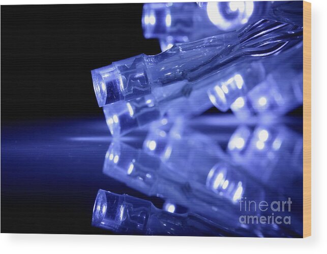 Abstract Wood Print featuring the photograph Blue LED lights closeup with reflection by Simon Bratt