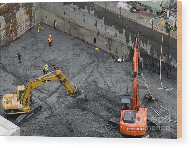 Construction Wood Print featuring the photograph CONSTRUCTION SITE diggers and workmen in the foundation pit of a new building Seattle by Andy Smy