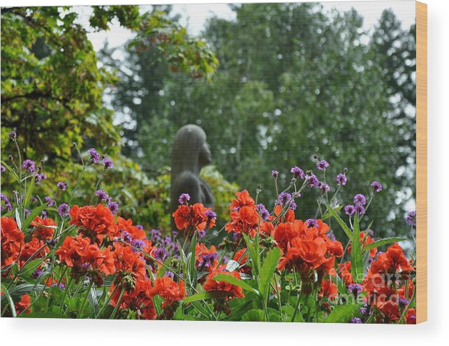 Girls Wood Print featuring the photograph Girl Behind Red Geraniums by Tatyana Searcy