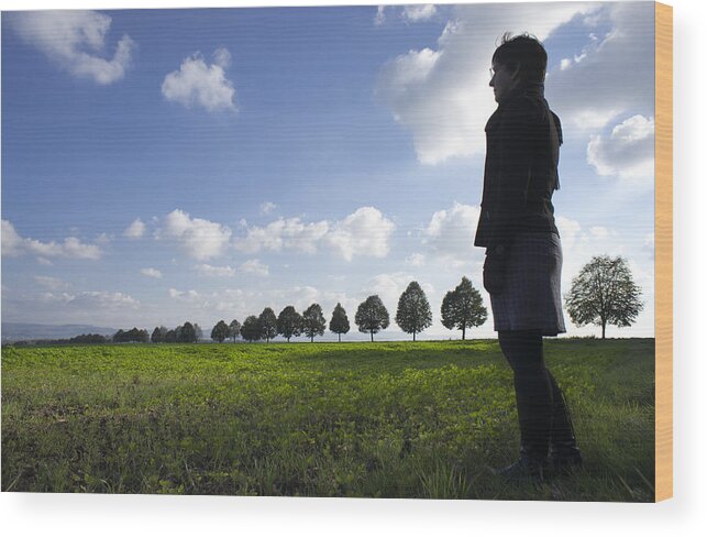 Person Wood Print featuring the photograph Landscape with row of trees and person by Matthias Hauser