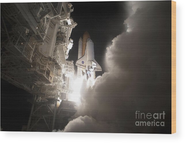 Nasa Wood Print featuring the photograph Space Shuttle Discovery Lifts Off by NASA/Tony Gray & Tom Farrar