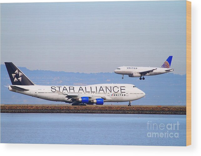 Airplane Wood Print featuring the photograph Star Alliance Airlines And United Airlines Jet Airplanes At San Francisco International Airport SFO by Wingsdomain Art and Photography