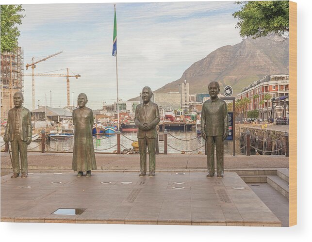 Bronze Wood Print featuring the photograph Nobel Square at waterfront in Cape Town with the four statues of #1 by Marek Poplawski