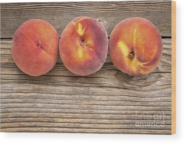 Abstract Wood Print featuring the photograph Peach Fruits On Weathered Wood #1 by Marek Uliasz