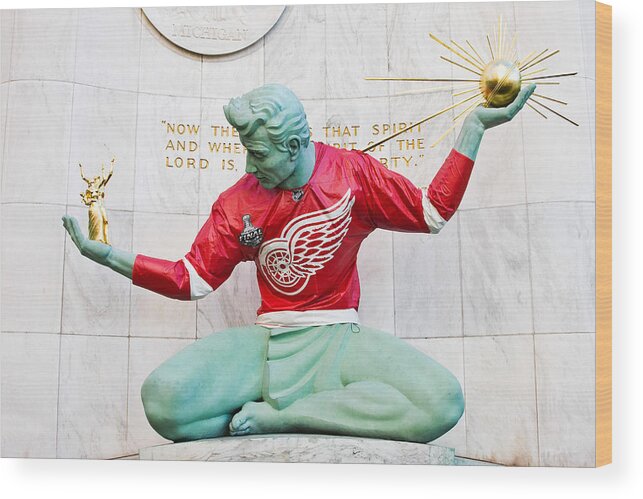 Michigan Wood Print featuring the photograph Spirit Of Detroit In Red Wing Jersey #1 by James Marvin Phelps