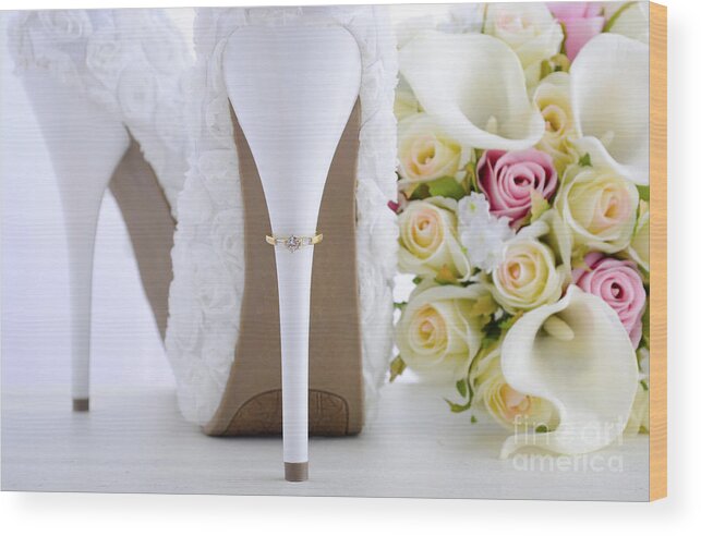 Arum Wood Print featuring the photograph Wedding ring on beautiful white stiletto shoe heel. #1 by Milleflore Images