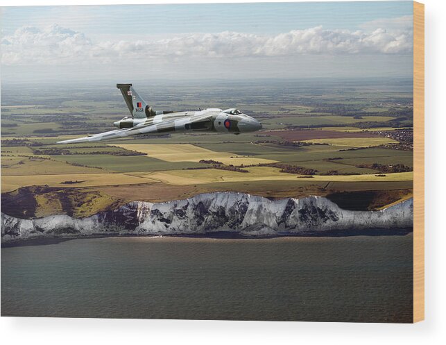 Avro Vulcan Wood Print featuring the photograph Avro Vulcan over the white cliffs of Dover by Gary Eason
