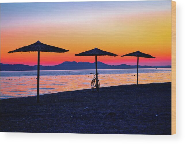 Zadar Wood Print featuring the photograph Beach and parasols on colorful sunset view by Brch Photography