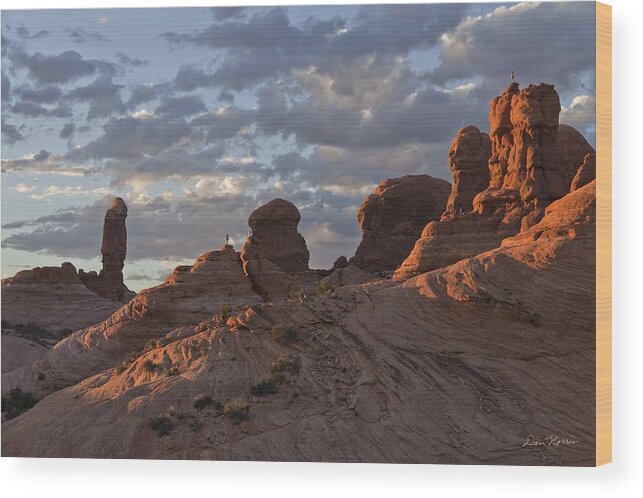 Arches National Park Wood Print featuring the photograph Climbers at sunset in Garden of Eden by Dan Norris