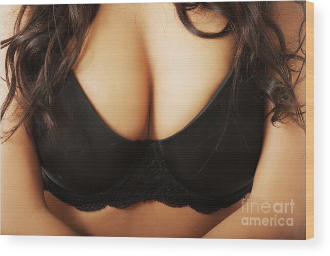 Close up on female boobs in black bra Wood Print by Piotr