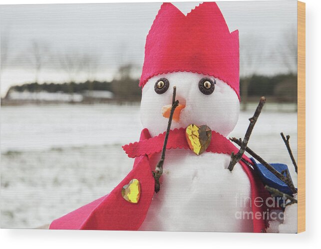 Snowman Wood Print featuring the photograph Cute snowmen dressed as a king with crown and cape by Simon Bratt