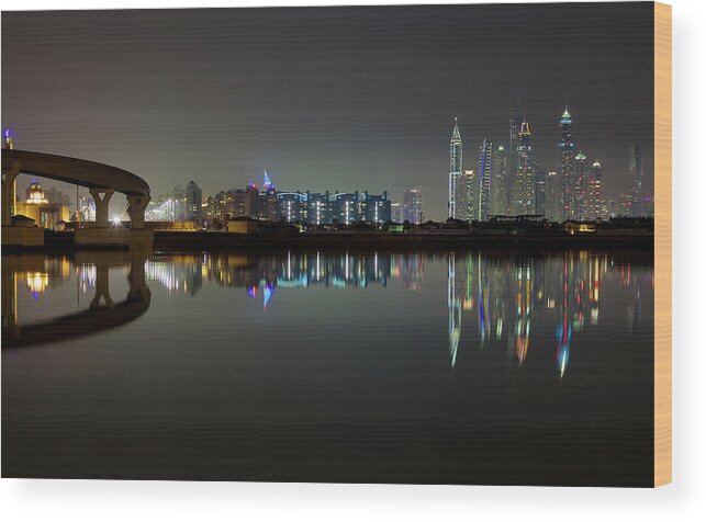Dubai Wood Print featuring the photograph Dubai city skyline night time reflection by Andy Myatt