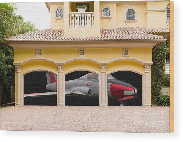 Triple Wood Print featuring the photograph Fighter jet in a garage by Les Palenik