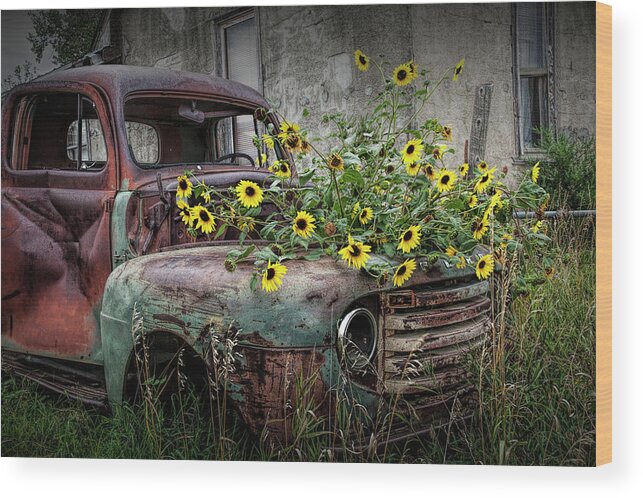 Art Wood Print featuring the photograph Ford Truck with Yellow Flowers abandoned in the Ghost Town by Okaton South Dakota by Randall Nyhof