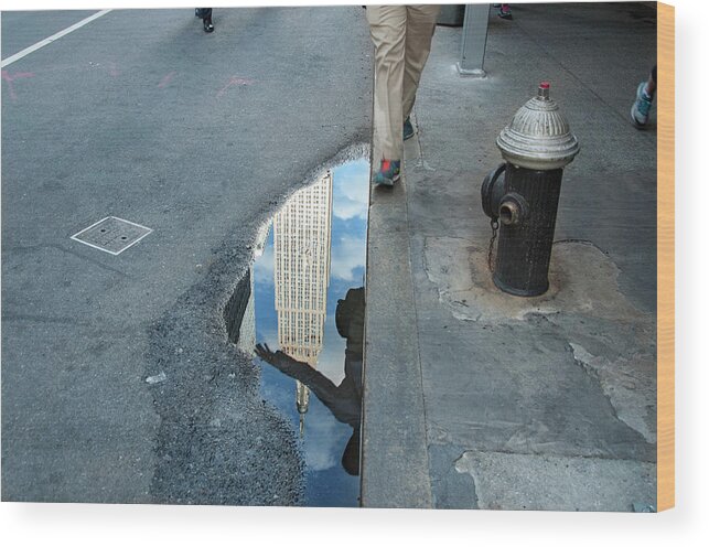 Manhattan Wood Print featuring the photograph Free in Manhattan - Man hopping over a puddle by Vinayak Garg